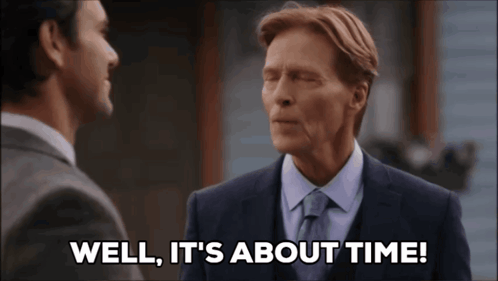 A Man Says Well It 'S About Time While Talking To Another Man GIF