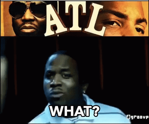 A Man Says What In Front Of A Picture Of A Man Wearing Sunglasses GIF