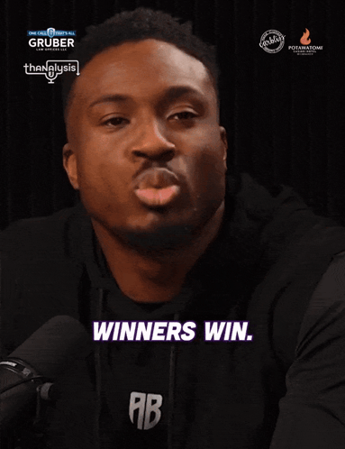 A Man Says Winners Win While Wearing A Black Shirt GIF