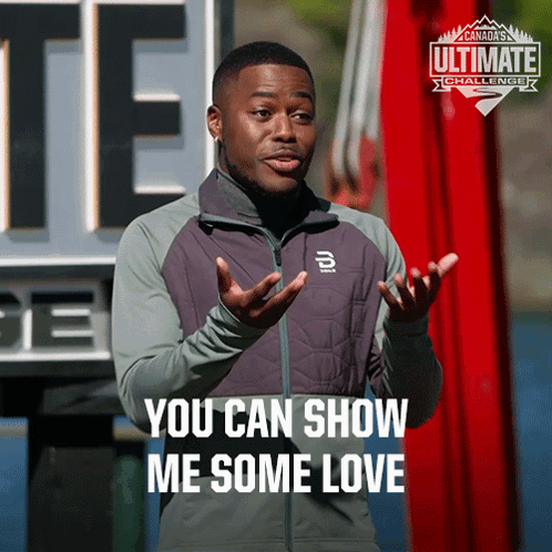 A Man Says You Can Show Me Some Love In Front Of A Sign That Says Ultimate Challenge GIF