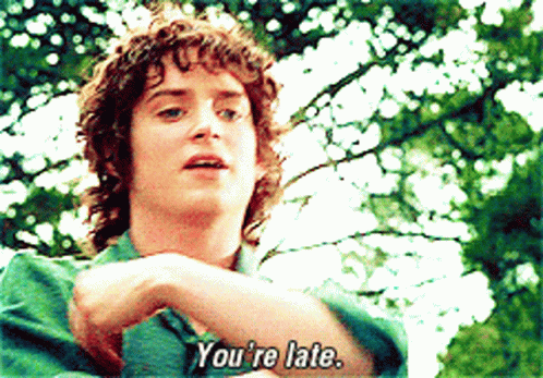 A Man Says You 'Re Late In Front Of Trees GIF