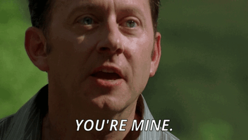 A Man Says " You 'Re Mine " In A Close Up Of His Face GIF