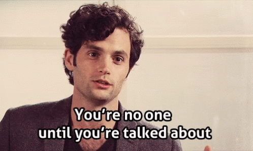 A Man Says " You 'Re No One Until You 'Re Talked About " In Front Of A White Wall GIF