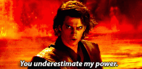 A Man Says " You Underestimate My Power " In Front Of Fire GIF