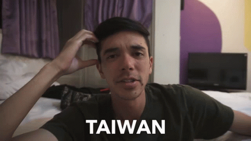 A Man Scratching His Head With The Word Taiwan On The Bottom Right GIF