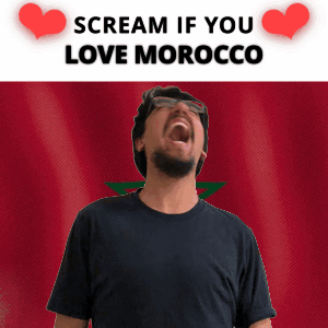 a man screaming in front of a morocco flag