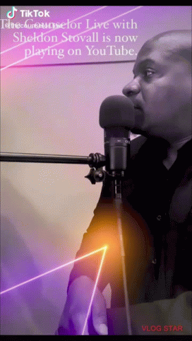 A Man Singing Into A Microphone With A Tiktok Logo On The Bottom Right GIF