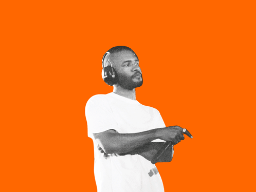 A Man Singing Into A Microphone With Headphones On GIF