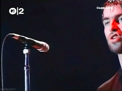 Man Singing Into Microphone Oasis Live GIF