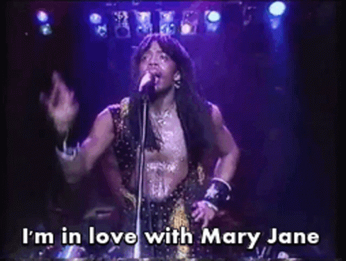 A Man Singing Into A Microphone With The Caption I 'M In Love With Mary Jane GIF