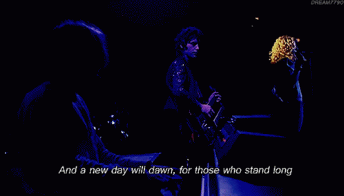 A Man Singing Into A Microphone With The Words " And The Forests Will Echo With Laughter " Next To Him GIF