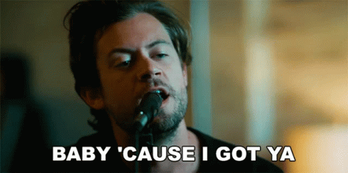 A Man Singing Into A Microphone With The Words Baby Cause I Got Ya Written Below Him GIF