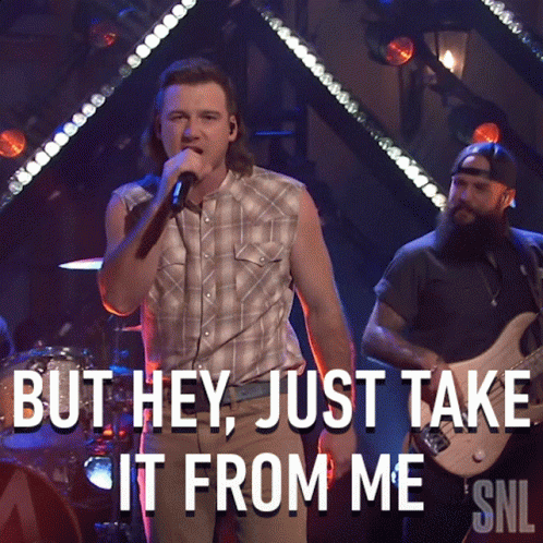 A Man Singing Into A Microphone With The Words But Hey Just Take It From Me GIF