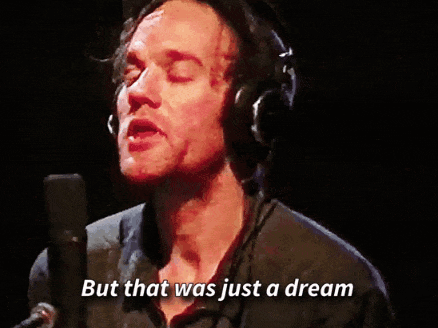 A Man Singing Into A Microphone With The Words But That Was Just A Dream GIF