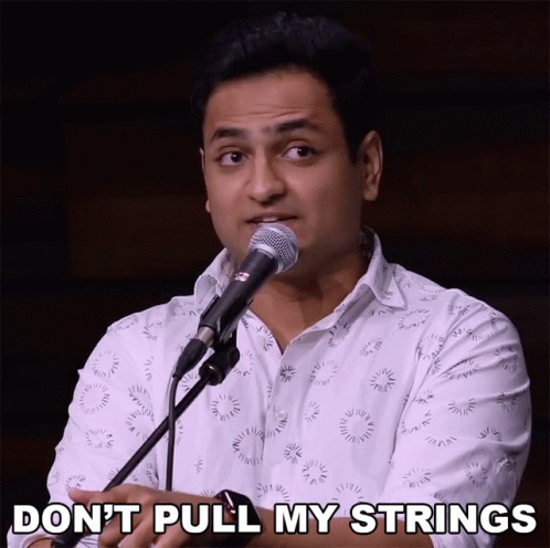 A Man Singing Into A Microphone With The Words " Do N't Pull My Strings " Written Below Him GIF