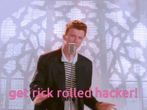 A Man Singing Into A Microphone With The Words Get Rick Rolled Hacker Written Below Him GIF