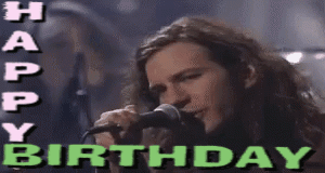 a man singing into a microphone with the words happy birthday written above him