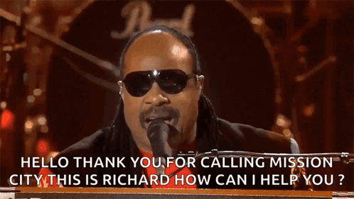 A Man Singing Into A Microphone With The Words Hello Thank You For Calling Mission City On The Bottom GIF