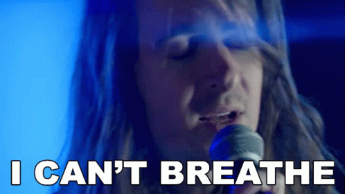 A Man Singing Into A Microphone With The Words " I Can 'T Breathe " Next To Him GIF