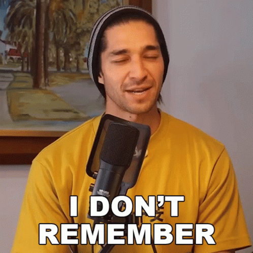 A Man Singing Into A Microphone With The Words " I Don 'T Remember " Written On His Shirt GIF