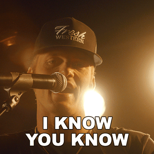 A Man Singing Into A Microphone With The Words I Know You Know Above Him GIF