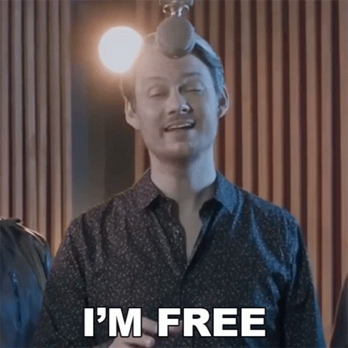 A Man Singing Into A Microphone With The Words I 'M Free Above Him GIF