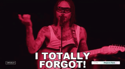 A Man Singing Into A Microphone With The Words " I Totally Forgot " Above Him GIF