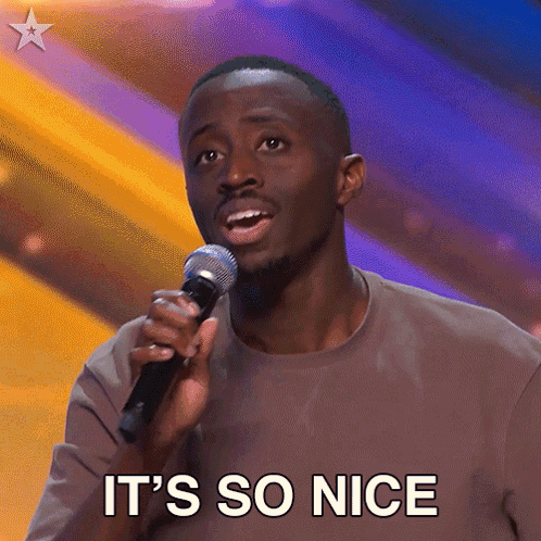 A Man Singing Into A Microphone With The Words It 'S So Nice Written Below Him GIF