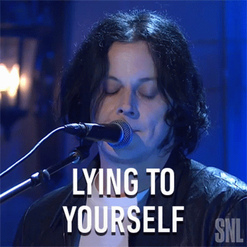 A Man Singing Into A Microphone With The Words Lying To Yourself On The Bottom GIF