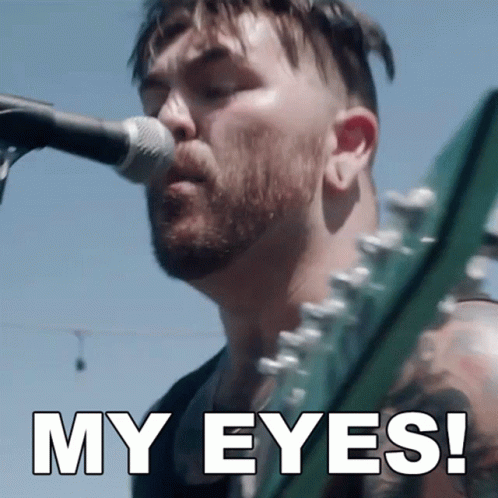 A Man Singing Into A Microphone With The Words " My Eyes " Above Him GIF