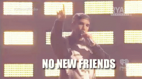 A Man Singing Into A Microphone With The Words " No New Friends " On The Bottom GIF