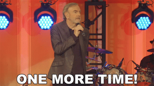a man singing into a microphone with the words " one more time " below him