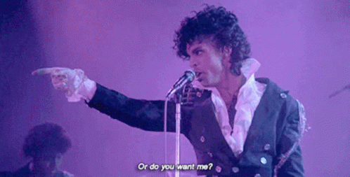 A Man Singing Into A Microphone With The Words " Or Do You Want Me " Above Him GIF
