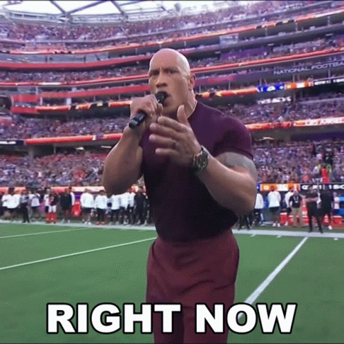 A Man Singing Into A Microphone With The Words Right Now Written Below Him GIF