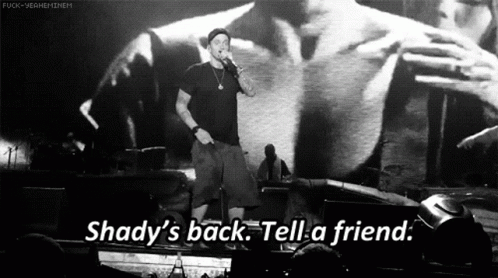 A Man Singing Into A Microphone With The Words Shady 'S Back Tell A Friend On The Bottom GIF