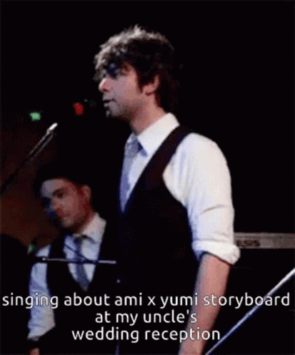 a man singing into a microphone with the words singing about ami x yumi storyboard at my uncle 's wedding reception belo