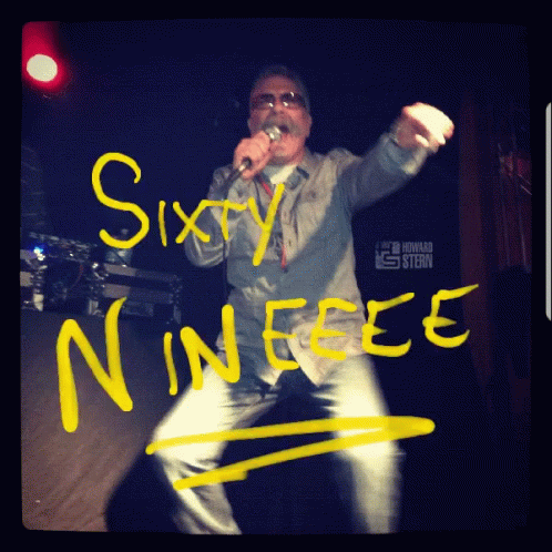 A Man Singing Into A Microphone With The Words Sixty Nineee Written On The Wall GIF