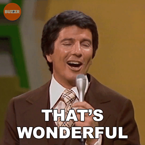 A Man Singing Into A Microphone With The Words That 'S Wonderful Above Him GIF