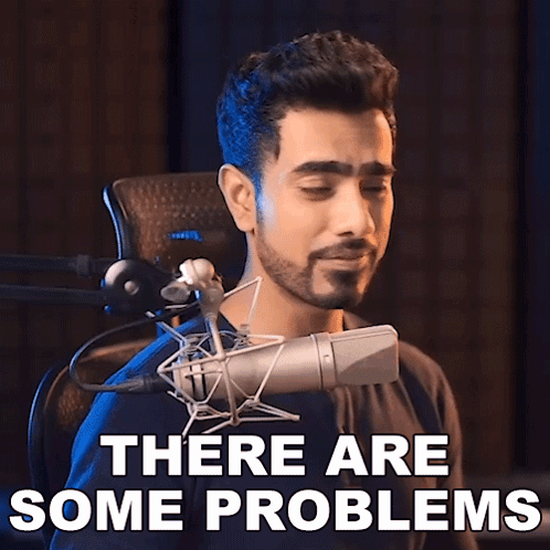 A Man Singing Into A Microphone With The Words " There Are Some Problems " Behind Him GIF