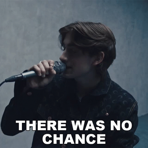 A Man Singing Into A Microphone With The Words There Was No Chance Behind Him GIF
