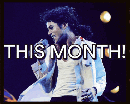 A Man Singing Into A Microphone With The Words This Month GIF