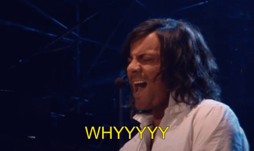 A Man Singing Into A Microphone With The Words " Whyyyy " Below Him GIF