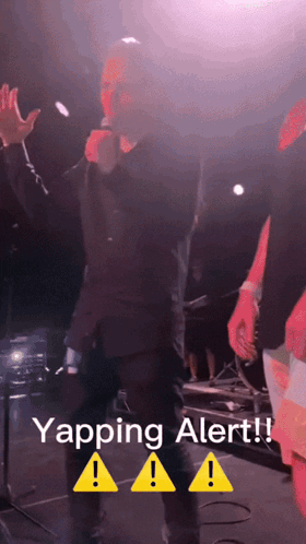 A Man Singing Into A Microphone With The Words Yapping Alert GIF