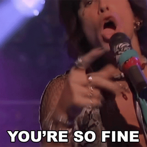 A Man Singing Into A Microphone With The Words " You 'Re So Fine " Behind Him GIF