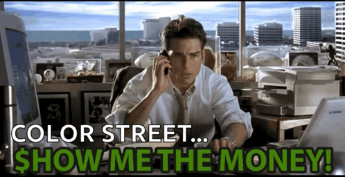 A Man Sits At A Desk Talking On A Cell Phone With The Words Color Street Show Me The Money Below Him GIF