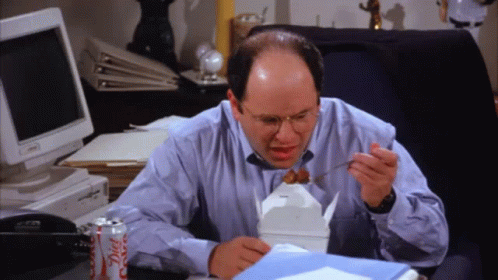 A Man Sits At A Desk With A Can Of Diet Coke Next To Him GIF