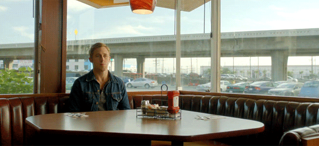 A Man Sits At A Diner Table With A Ketchup Bottle On It GIF