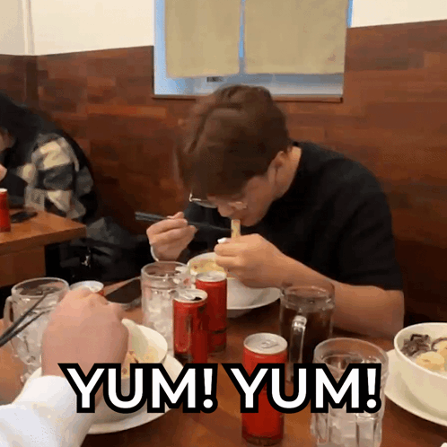 A Man Sits At A Table With A Can Of Coca Cola In Front Of Him And The Words Yum Yum GIF