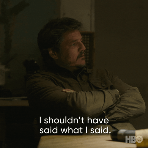 A Man Sits At A Table With His Arms Crossed And Says I Shouldn T Have Said What I Said GIF