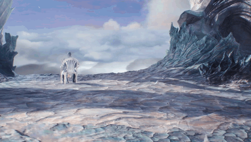A Man Sits In A Chair In The Middle Of A Snowy Landscape GIF